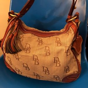 Dooney & Bourke Tote Purse Brown/Tan with tassels.